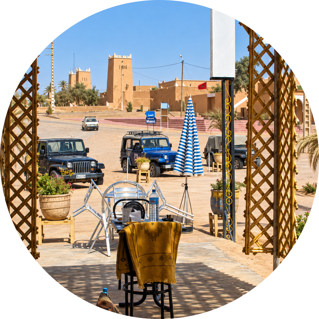 Village square and cafés seen through a shaded lattice arch