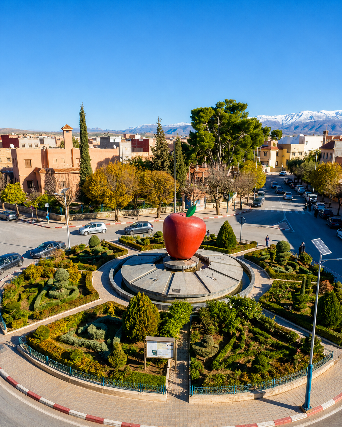Midelt apple monument roundabout with the Atlas mountains beyond