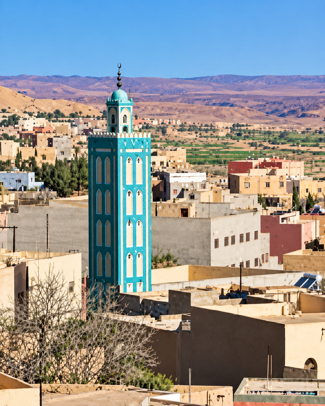 Turquoise minaret rising above a Midelt neighbourhood