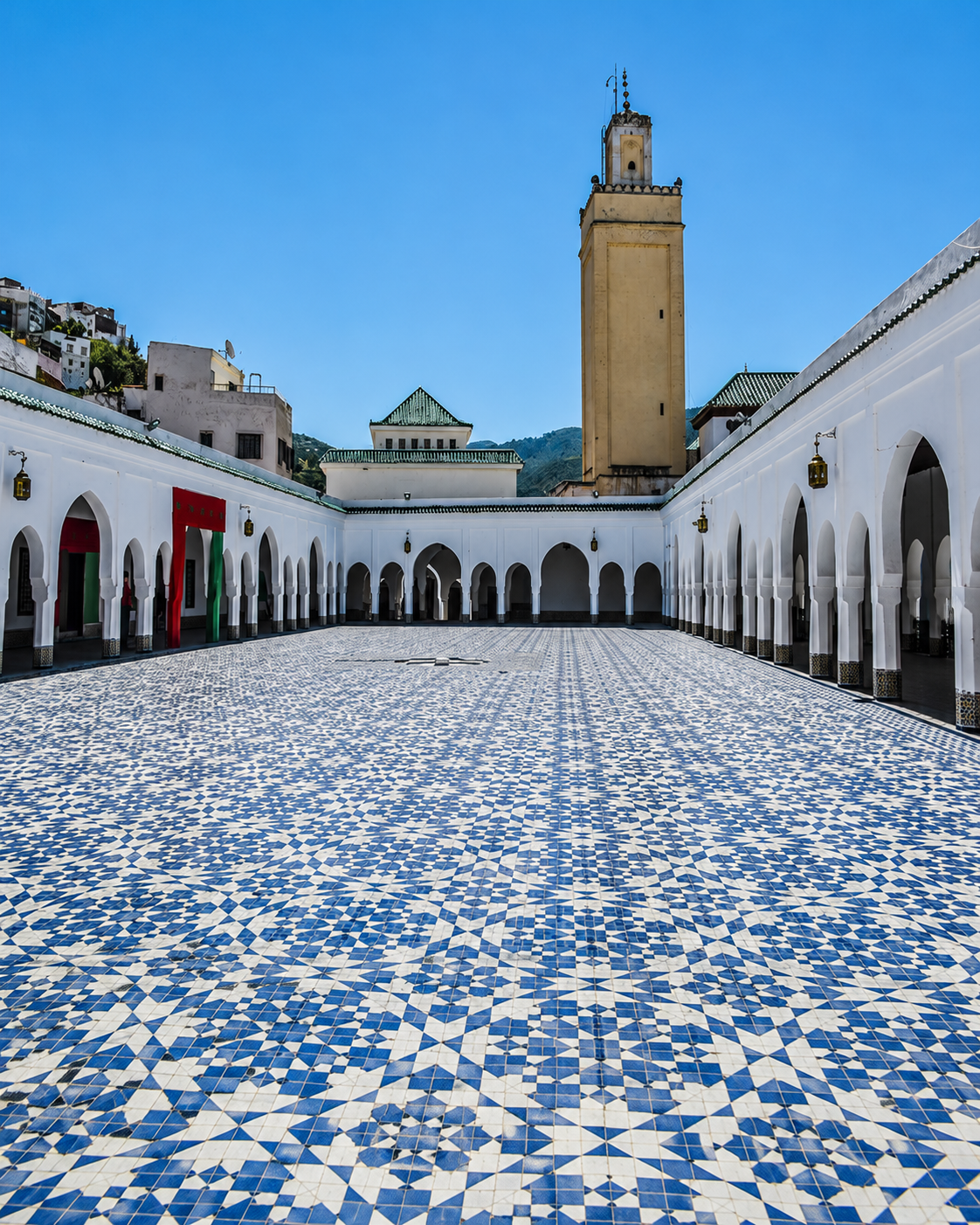 Tiled courtyard and minaret in Moulay Idriss Zerhoun