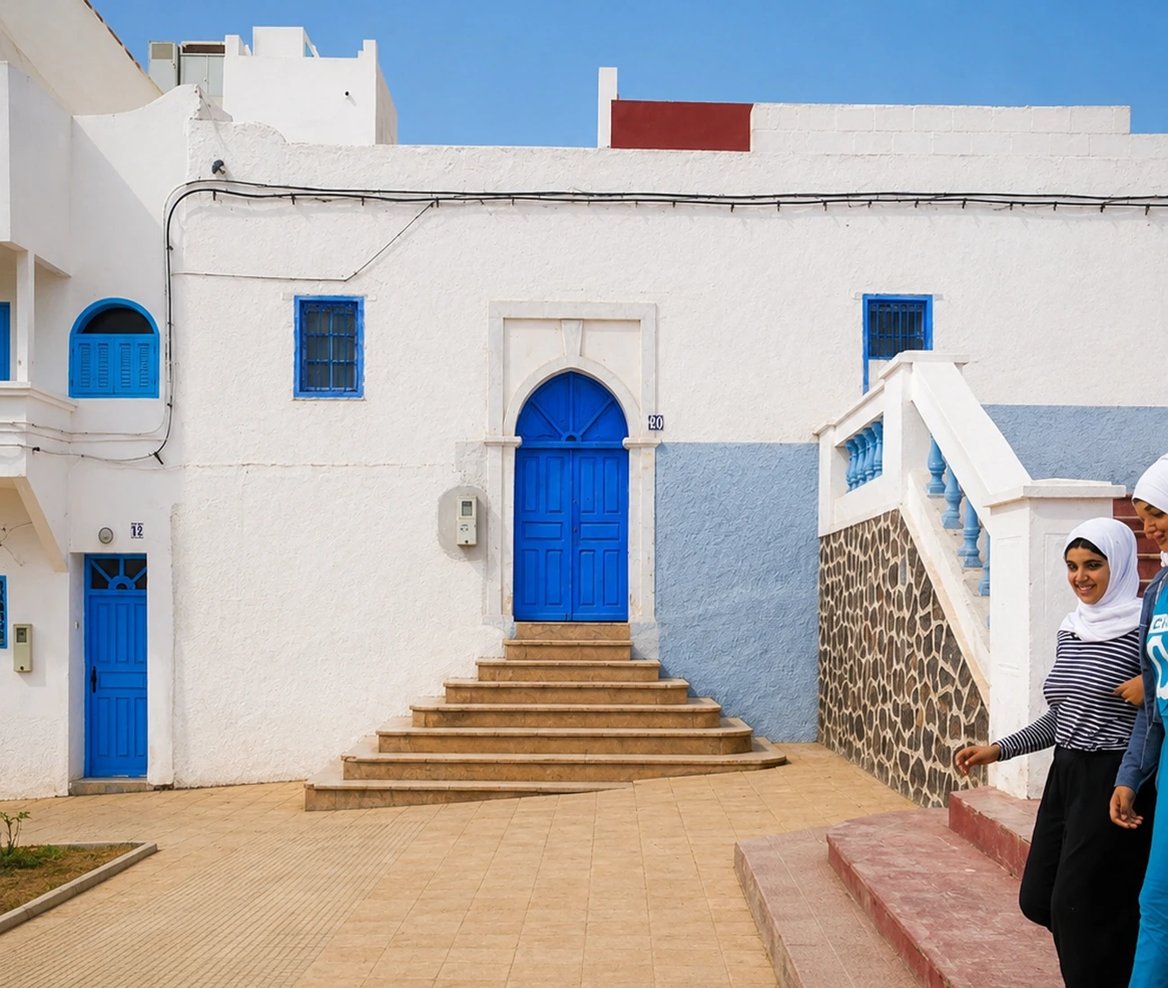 Blue door, stairs and white façades in Sidi Ifni