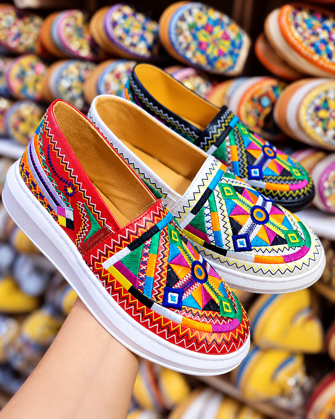 Colourful embroidered slippers displayed close up