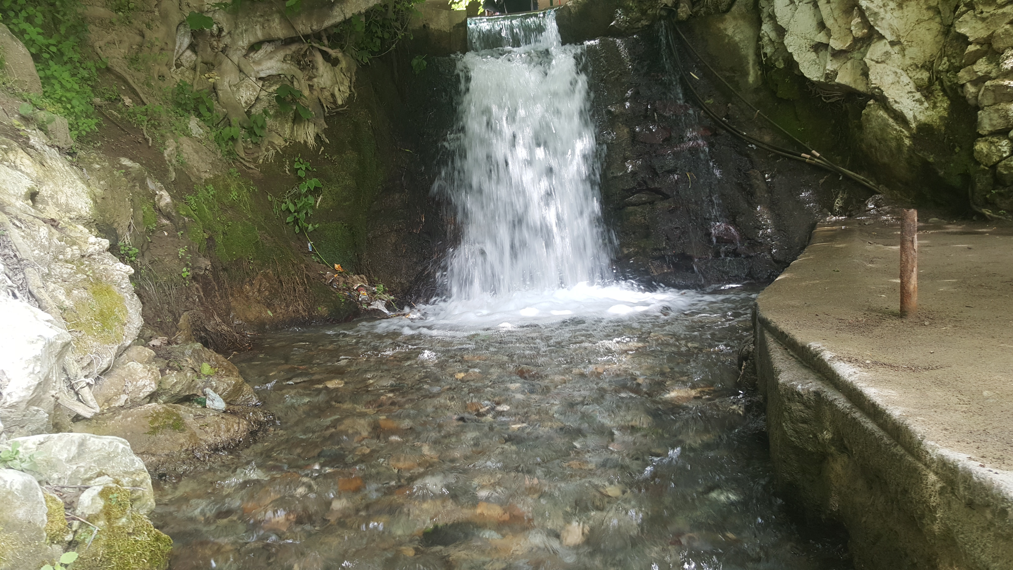 Waterfall and stone-lined watercourse at Bouadel