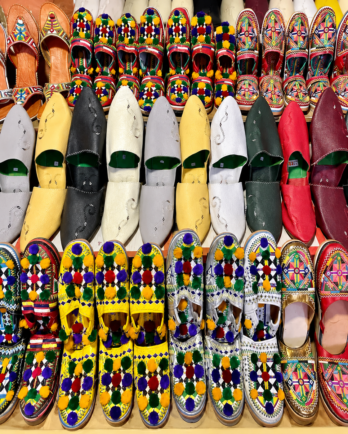 Colourful babouche display inside a Taroudant souk