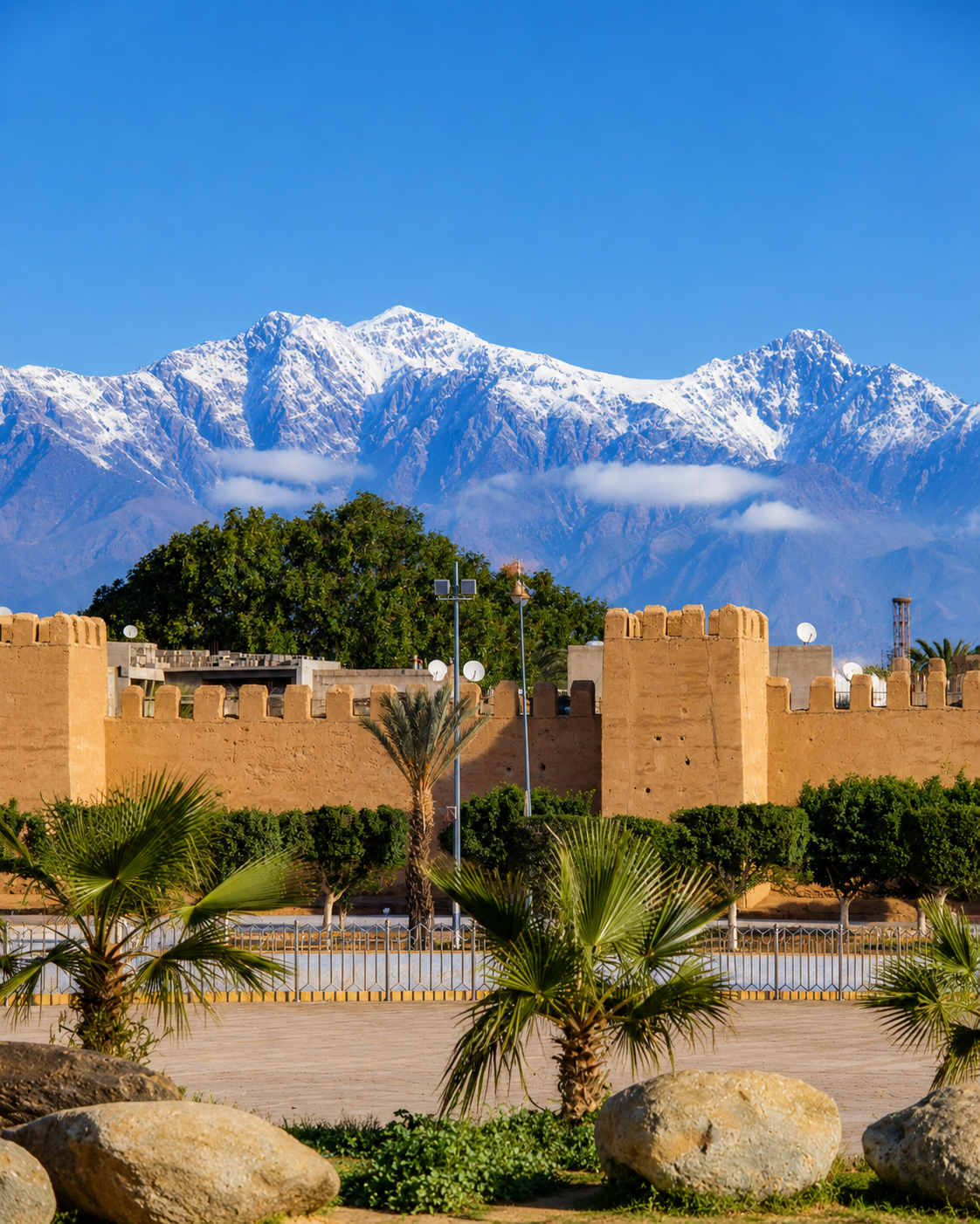 Ochre walls, palms and Atlas mountains around Taroudant