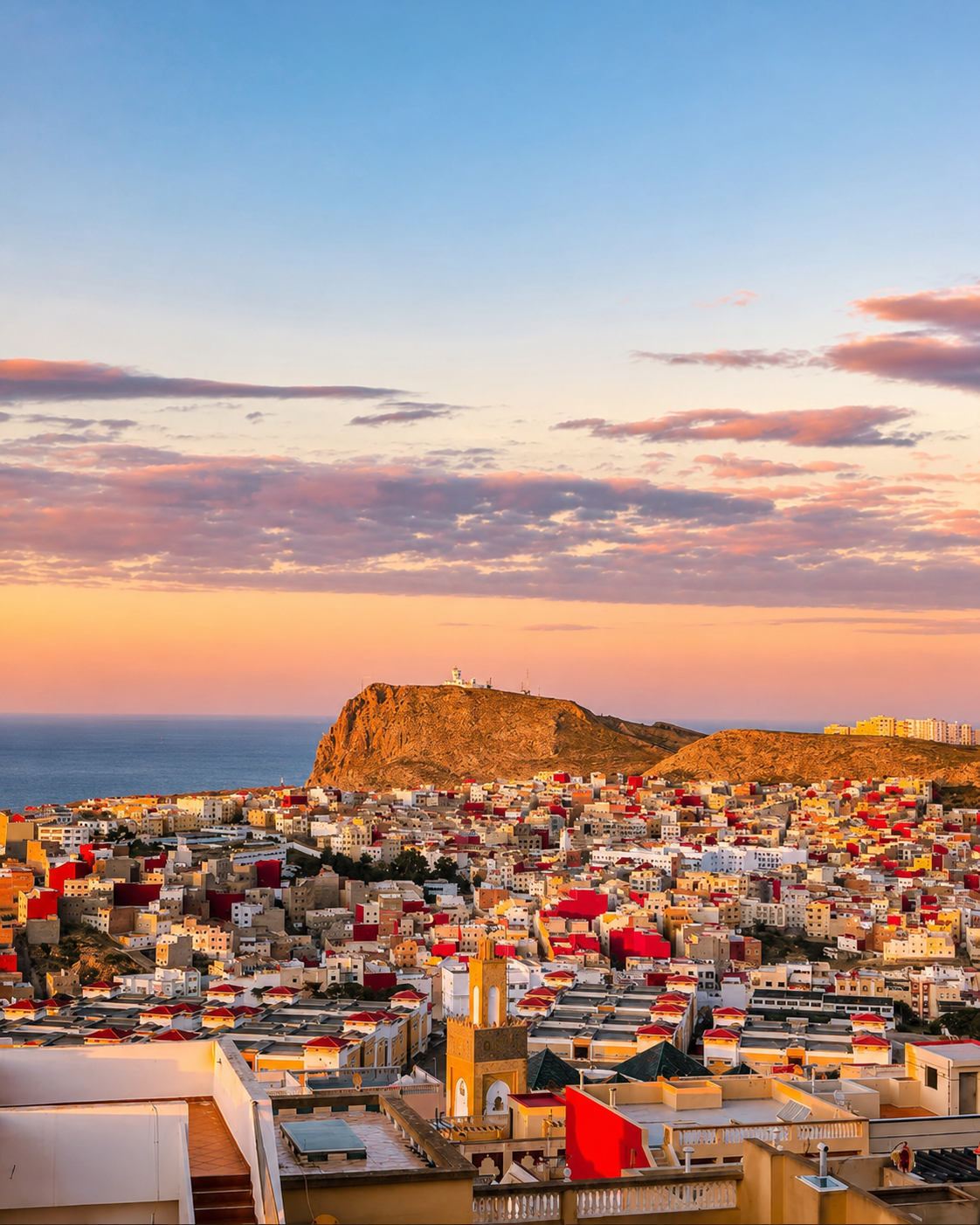 Al Hoceima city at sunset above the Mediterranean, the guide context for Quemado Beach