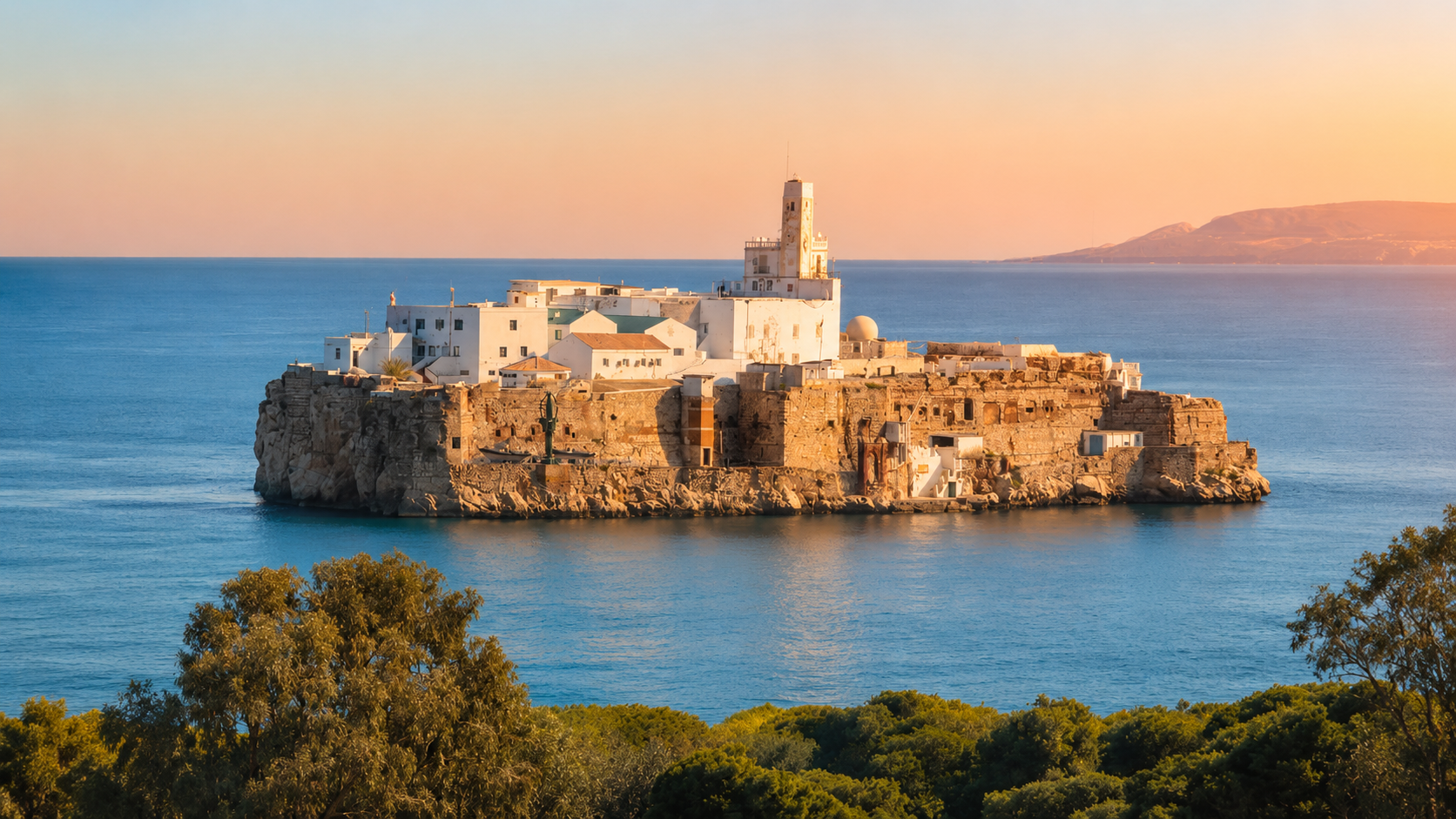 Sfiha Beach on the Rif coast near Al Hoceima, with blue Mediterranean water and offshore rocky islets