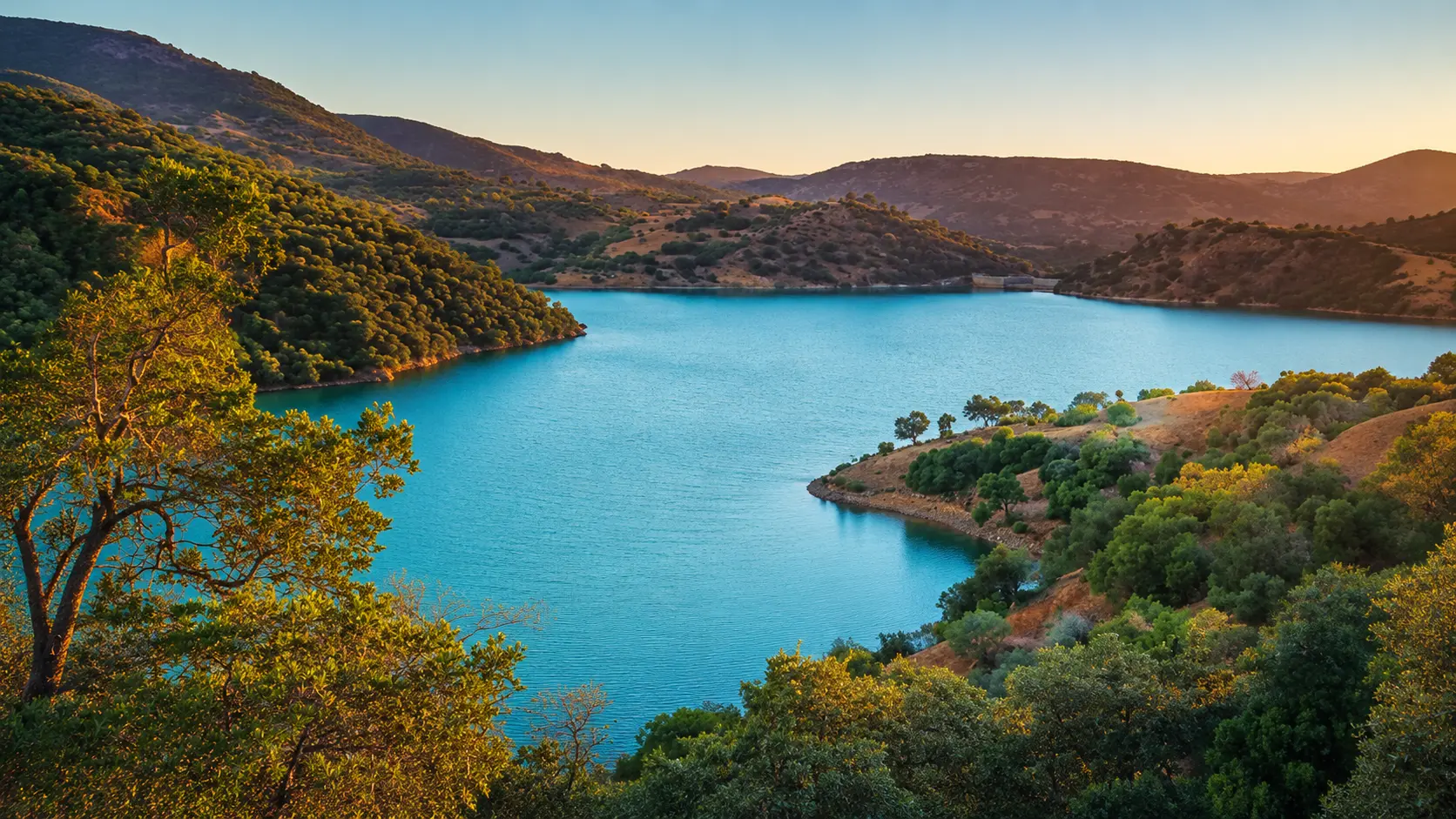 Blue mountain water, forested slopes and sunset light in Tazekka National Park near Taza, Morocco